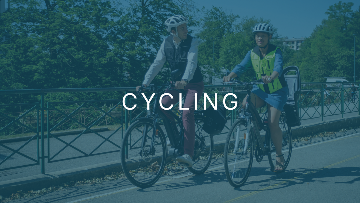 Two cyclists on a shared path, one wearing a hi-vis airbag vest