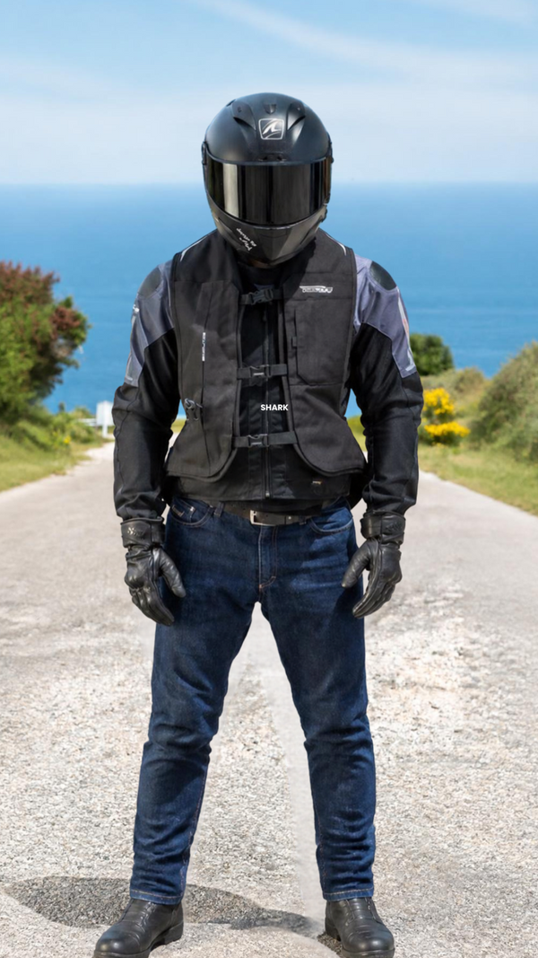 Motorcyclist wearing a Helite Turtle airbag vest over a riding jacket
