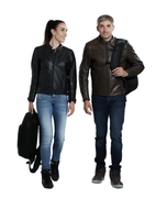 Two riders walking, one carrying the Helite H-Moov airbag backpack by the handle