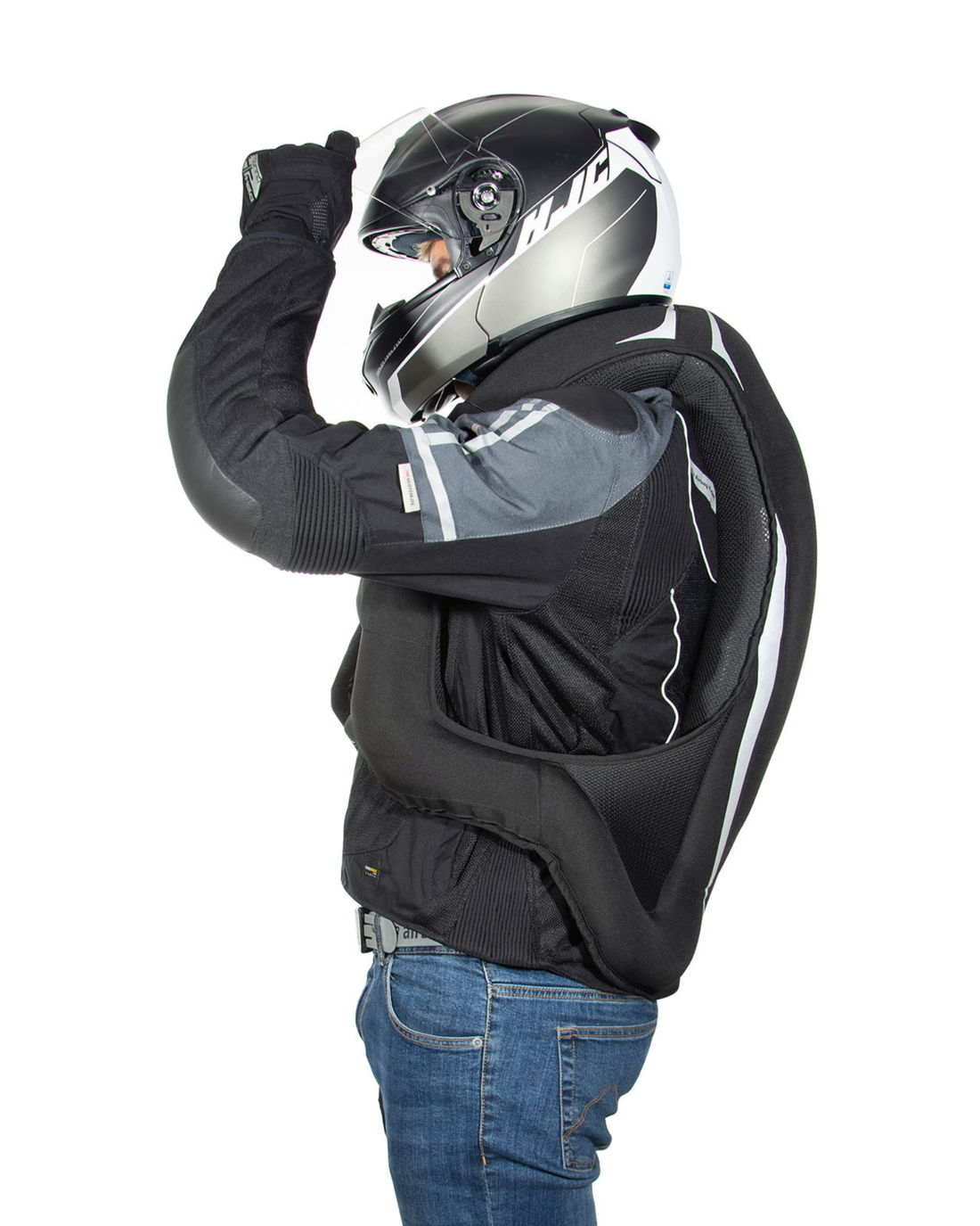 Rider wearing the black Turtle 2 airbag vest with the airbag inflated around the neck and shoulders