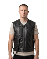Man wearing the custom Helite leather airbag vest in black over a T-shirt, front view with the lanyard hanging at the front