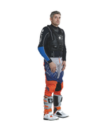 Side view of a rider wearing the Helite Off Road airbag vest with motocross pants and boots