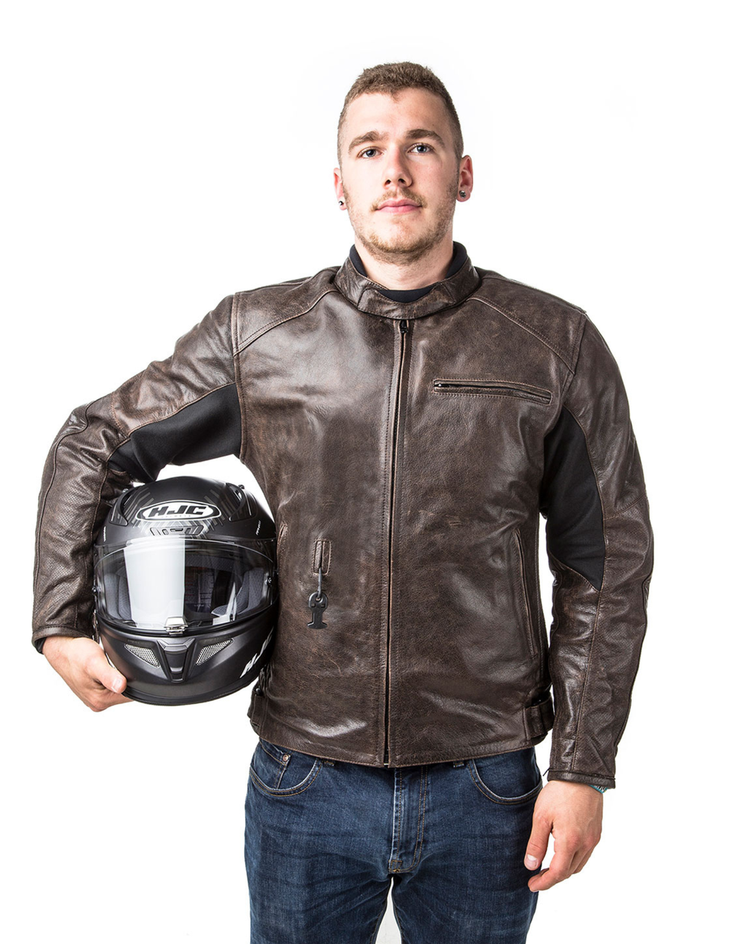 Man holding a helmet while wearing the brown vintage Roadster leather airbag jacket