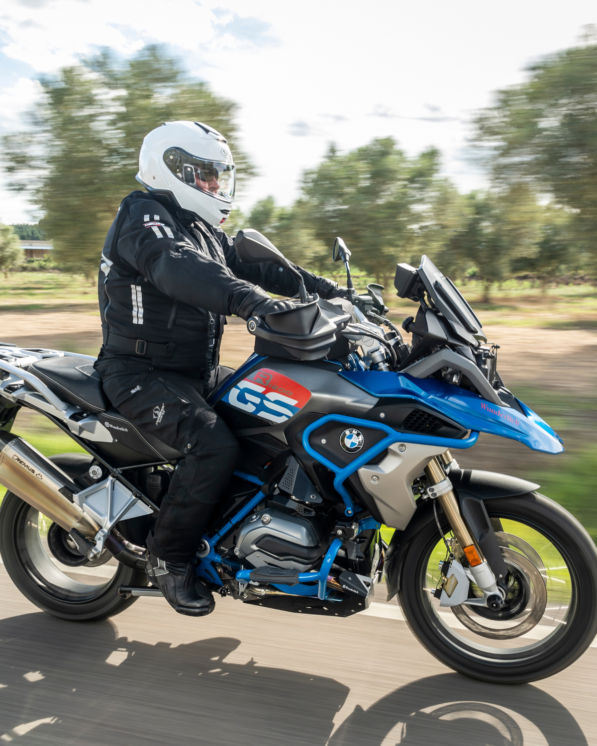 Rider wearing the Helite Touring airbag jacket on an adventure motorcycle