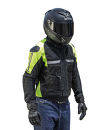 Rider in a full-face helmet wearing the Helite Vented airbag jacket